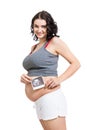 Pregnant woman displaying a prenatal ultrasound