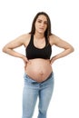 Pregnant woman upset with her too tight jeans Royalty Free Stock Photo