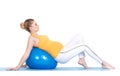 A pregnant woman does gymnastics with ball Royalty Free Stock Photo