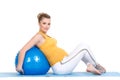 A pregnant woman does gymnastics with ball Royalty Free Stock Photo