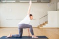 Pregnant woman does yoga in the gym