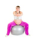 Pregnant woman doing exercises on fitness ball Royalty Free Stock Photo