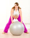 Pregnant woman doing exercises on fitness ball Royalty Free Stock Photo