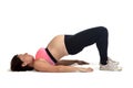 Pregnant woman doing floor exercises on white background