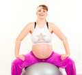 Pregnant woman doing pilates exercises on ball Royalty Free Stock Photo