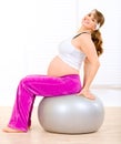 Pregnant woman doing pilates exercises on ball Royalty Free Stock Photo