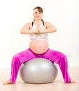 Pregnant woman doing pilates exercises on ball Royalty Free Stock Photo