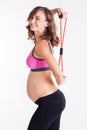 Pregnant woman doing pilates with rubber band Royalty Free Stock Photo