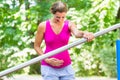 Pregnant woman doing pregnancy exercises on Fitness-Trail