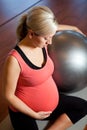 Pregnant woman doing relaxation exercise