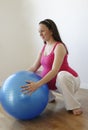 Pregnant woman doing squatting exercise Royalty Free Stock Photo