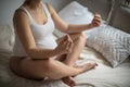 Pregnant woman doing yoga exercise on bed Royalty Free Stock Photo