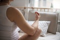 Pregnant woman doing yoga exercise on bed Royalty Free Stock Photo