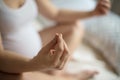 Pregnant woman doing yoga exercise on bed Royalty Free Stock Photo