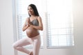 Pregnant woman doing yoga at home Royalty Free Stock Photo
