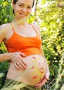 Pregnant woman with drawing of sun. Royalty Free Stock Photo