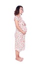 Pregnant woman in dress isolated on white background Royalty Free Stock Photo