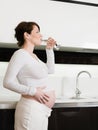 Pregnant woman drinking water Royalty Free Stock Photo