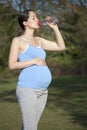 Pregnant woman drinking water Royalty Free Stock Photo