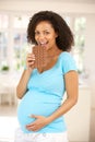 Pregnant woman eating chocolate Royalty Free Stock Photo