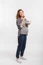 pregnant woman eating salad and smiling at camera Royalty Free Stock Photo
