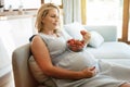 Pregnant woman eating strawberries Royalty Free Stock Photo