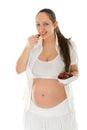 Pregnant woman eating strawberries Royalty Free Stock Photo