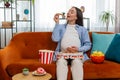 Pregnant woman eating unhealthy junk fatty fast food pizza popcorn crisp watching movie at home Royalty Free Stock Photo