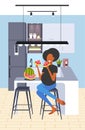 Pregnant woman eating watermelon fresh fruit african american girl having fun pregnancy and motherhood concept modern