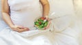 A pregnant woman eats a salad with vegetables. Selective focus Royalty Free Stock Photo