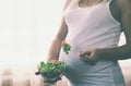 A pregnant woman eats a salad with vegetables. Selective focus Royalty Free Stock Photo