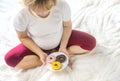 A pregnant woman eats sweet donuts. Selective Focus Royalty Free Stock Photo