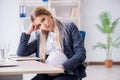 The pregnant woman employee in the office