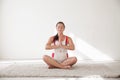 A pregnant woman is engaged in gymnastics and yoga