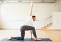 Pregnant woman is engaged in yoga. Low Lunge Twist Pose or Parivrtta Sanchalasana