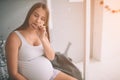 Pregnant woman enjoying of eating chocolate at home. Royalty Free Stock Photo