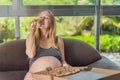 A pregnant woman enjoys a slice of pizza, savoring a moment of indulgence while satisfying her craving for a delightful Royalty Free Stock Photo