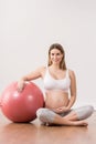 Pregnant woman exercising with ball Royalty Free Stock Photo