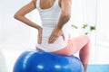 Pregnant woman exercising on exercise ball Royalty Free Stock Photo