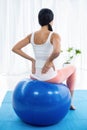 Pregnant woman exercising on exercise ball Royalty Free Stock Photo