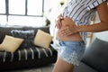 Pregnant woman expecting baby and taking care of skin and stretch marks Royalty Free Stock Photo