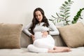 Pregnant woman experiences pain, abdominal discomfort, labor pains, birth pangs Royalty Free Stock Photo