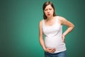 Pregnant woman feeling pain in the back and in the belly, contractions begin. Royalty Free Stock Photo