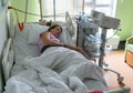 Pregnant woman feels hard contraction in a hospital labor delivery room. Concept photo of pregnancy, pregnant woman