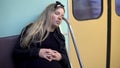 A pregnant woman fell asleep on a subway train. Old subway train car