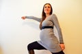 Pregnant woman fencing