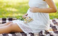 Pregnant woman and flowers