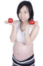 Pregnant woman with fresh tomato Royalty Free Stock Photo