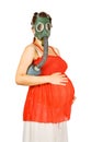 Pregnant woman in gas-mask holding belly