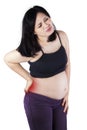 Pregnant woman getting back pain Royalty Free Stock Photo